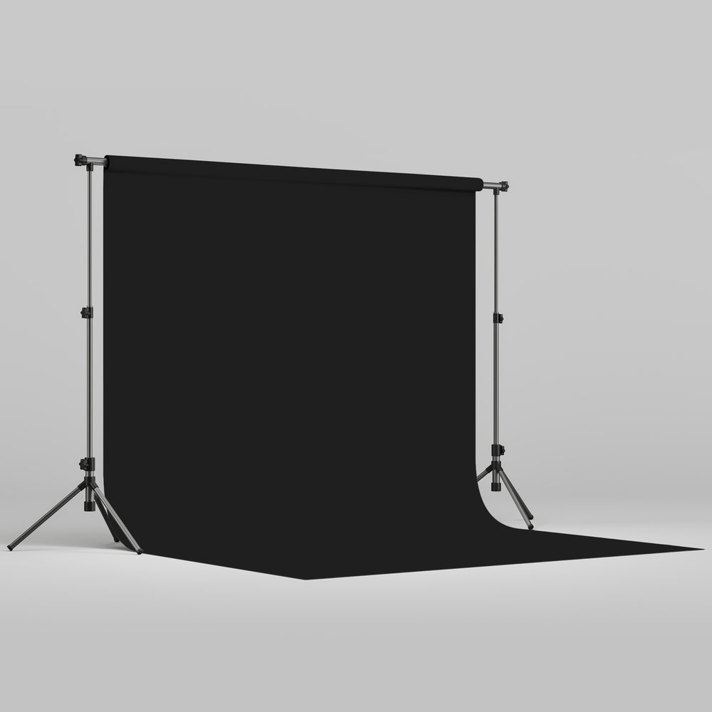 Fond papier noir jet trépied