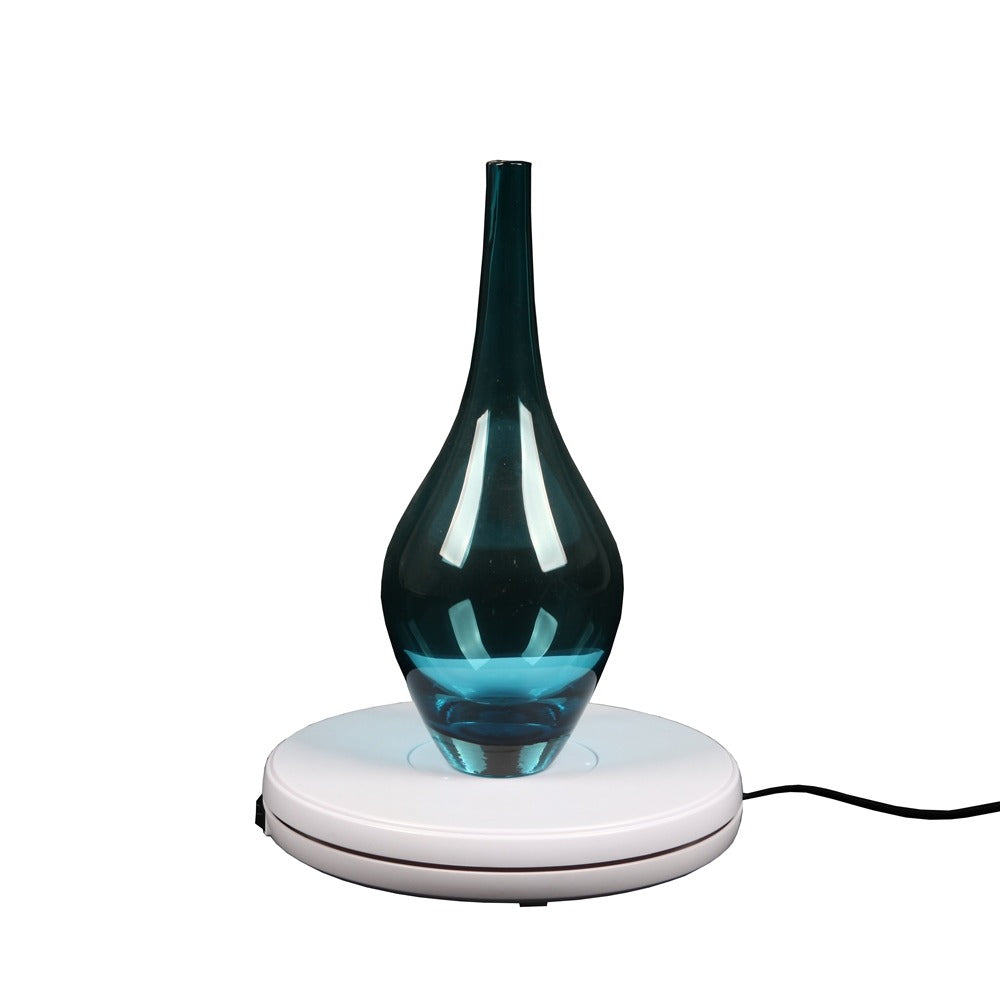 Plateau tournant Falcon Eyes T360-A2 25 cm présentant un vase