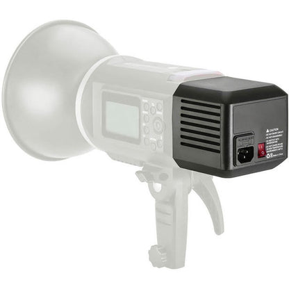 Adaptateur secteur Godox AD-AC en place sur un flash de la série AD600, vue de profil