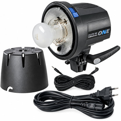 Flash studio Elinchrom D-Lite RX ONE avec son capuchon de protection, son câble de synchro et son câble secteur