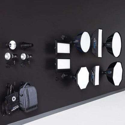 Mur de studio équipé du système Westcott Float avec lumières et softbox rangées