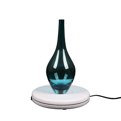 Plateau tournant Falcon Eyes T360-A2 25 cm présentant un vase 