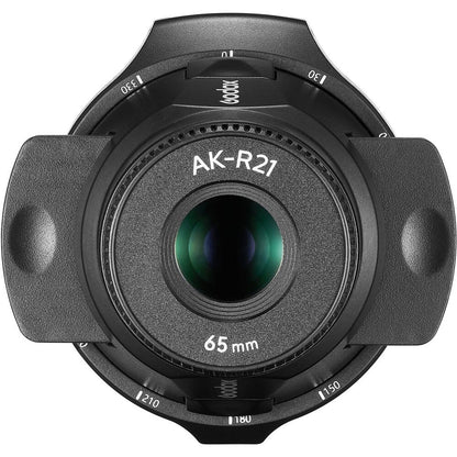 Projecteur Godox AK-R21 vu de face, objectif 65 mm au centre et graduations en degrés