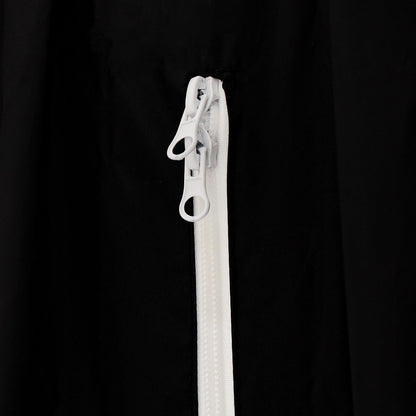 Fermeture éclair blanche sur la toile noire de la softwall StudioKing BGS200